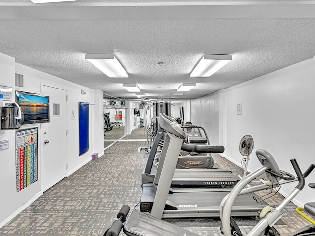 workout area with a textured ceiling