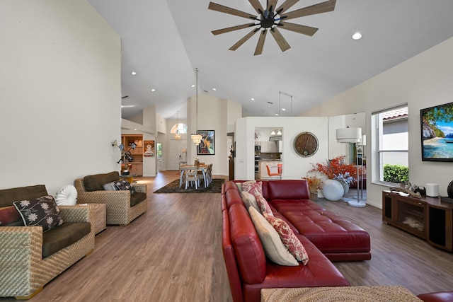 living room featuring high vaulted ceiling, a ceiling fan, recessed lighting, and wood finished floors