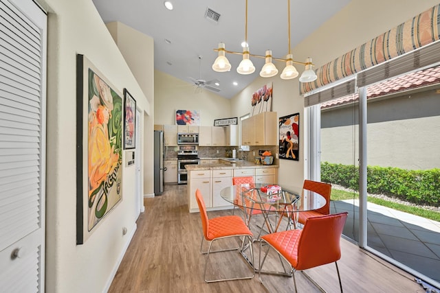 dining area featuring recessed lighting, ceiling fan, visible vents, and light wood-style flooring