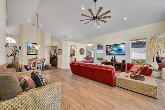 living room featuring light wood-type flooring, recessed lighting, ceiling fan, and high vaulted ceiling