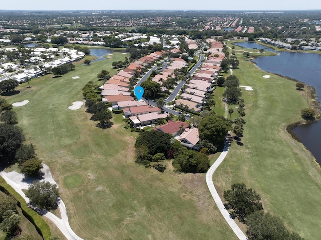 bird's eye view with a residential view, a water view, and golf course view