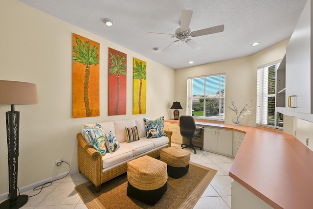 office featuring light tile patterned floors, ceiling fan, recessed lighting, and a textured ceiling