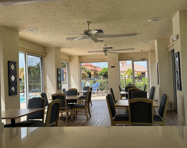 6090 Evian Pl, Boynton Beach, FL 33437 - dining room featuring plenty of natural light, a ceiling fan, and wood finished floors