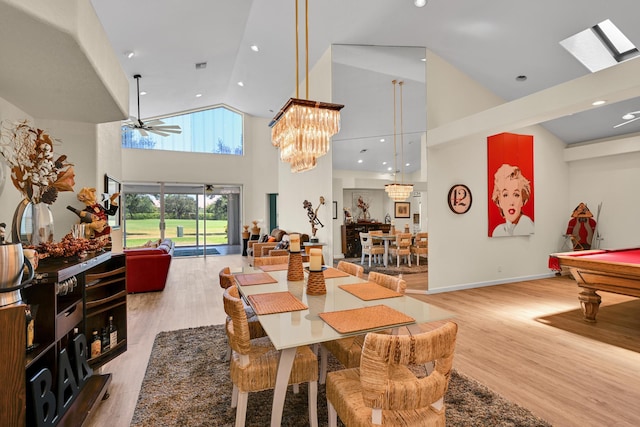 dining area featuring high vaulted ceiling, ceiling fan with notable chandelier, recessed lighting, pool table, and wood finished floors