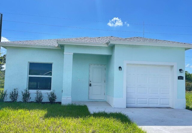 single story home with a garage