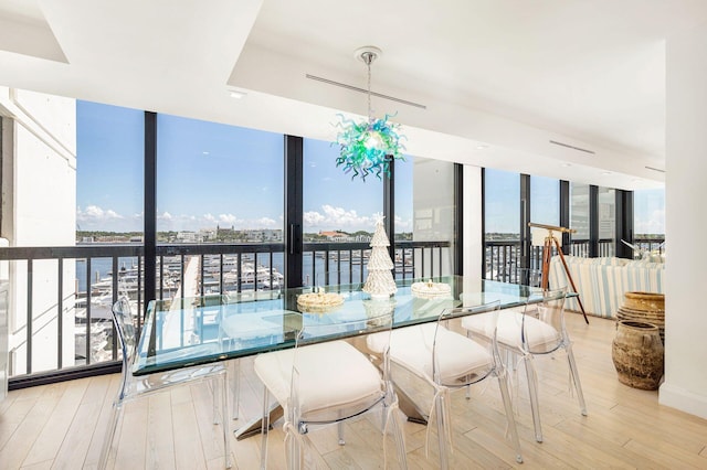 unfurnished sunroom with a water view