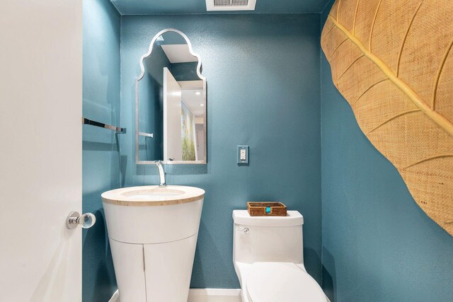 bathroom featuring toilet