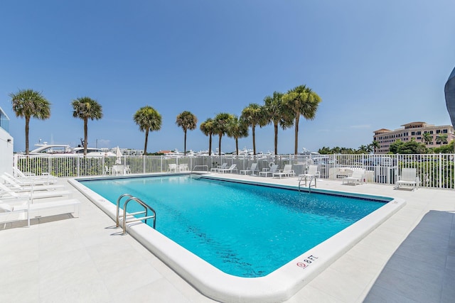 view of swimming pool featuring a patio area