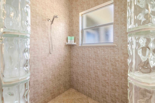 bathroom with tiled shower