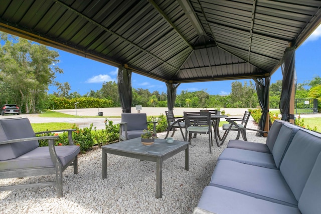 view of terrace with outdoor lounge area and a gazebo