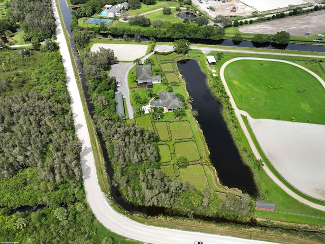 birds eye view of property with a water view