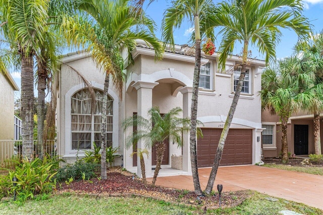 mediterranean / spanish-style home featuring a garage