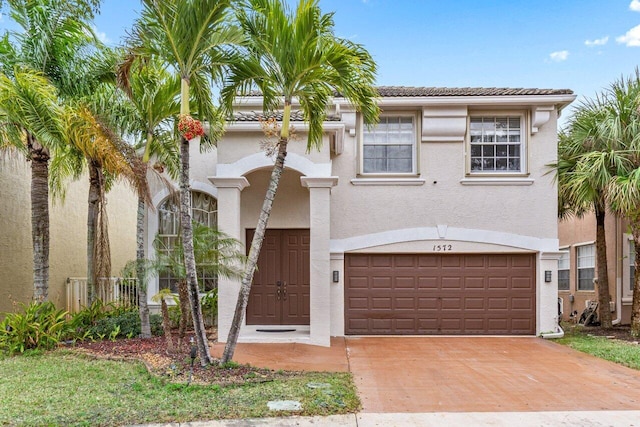 mediterranean / spanish house with a garage