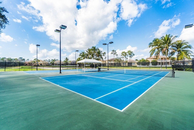 view of tennis court with basketball court