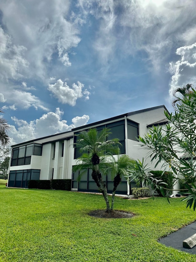 exterior space featuring a front lawn