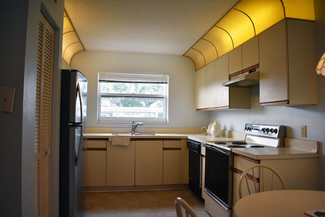 kitchen featuring black dishwasher, stainless steel fridge, white stove, and sink