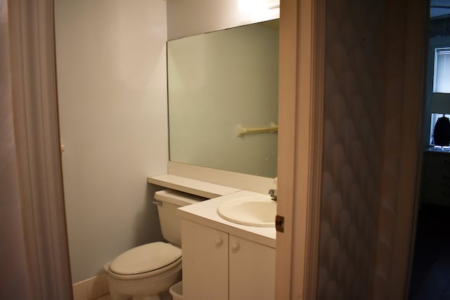 bathroom with toilet and vanity