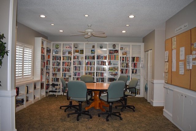 interior space featuring a textured ceiling and ceiling fan