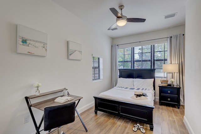 bedroom with ceiling fan and light hardwood / wood-style flooring