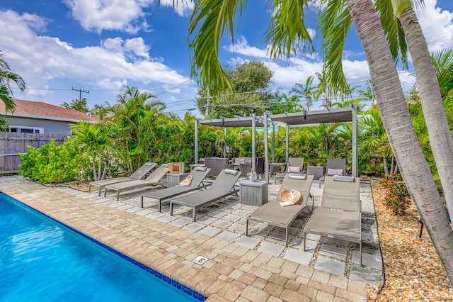 view of patio / terrace featuring a pergola and a fenced in pool