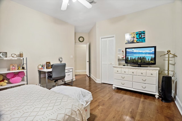 bedroom featuring dark hardwood / wood-style floors, a closet, and ceiling fan