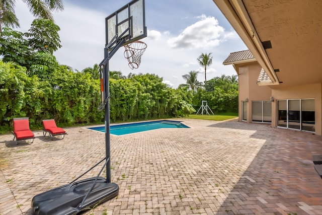 view of pool featuring a patio