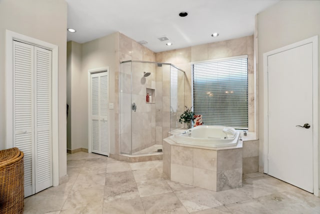 bathroom with independent shower and bath and tile floors