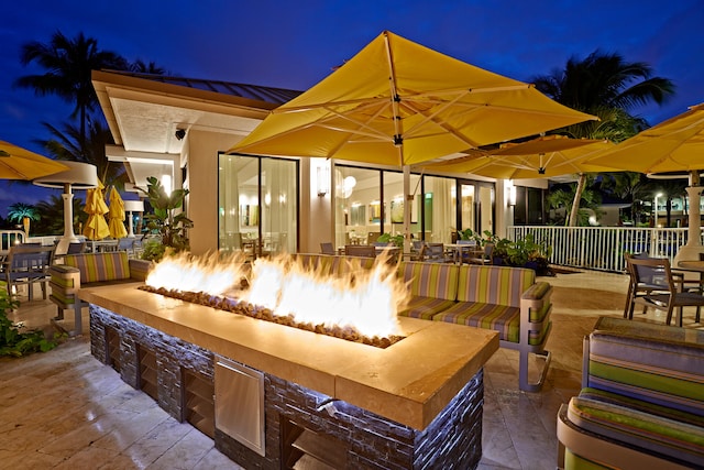 patio terrace at night with a fire pit