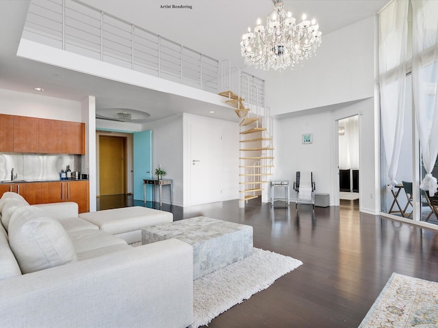 living room with an inviting chandelier, sink, dark wood-type flooring, and a towering ceiling