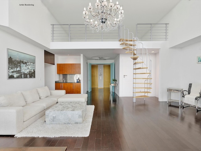 living room featuring a chandelier, dark hardwood / wood-style floors, and a towering ceiling