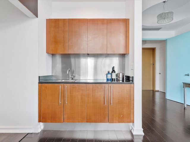 kitchen with dark hardwood / wood-style flooring