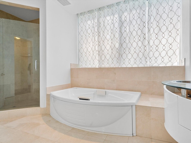 bathroom with shower with separate bathtub