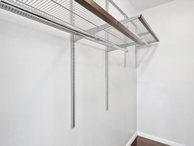 walk in closet featuring hardwood / wood-style floors