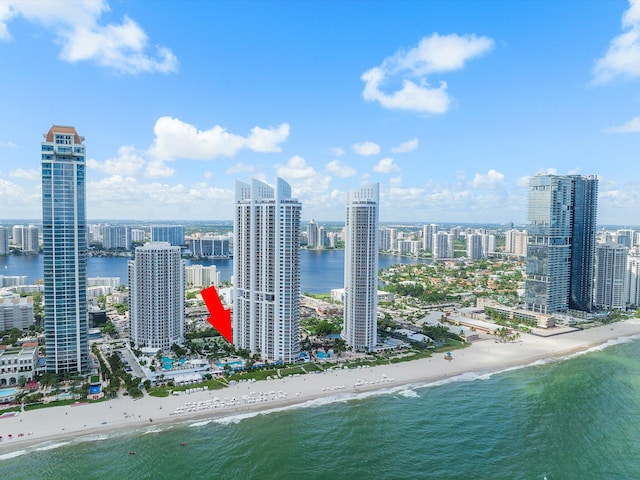 birds eye view of property featuring a water view and a view of the beach