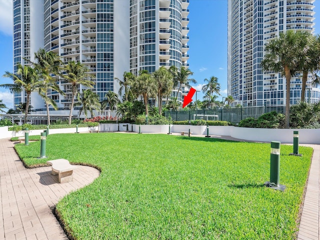 view of home's community featuring a lawn