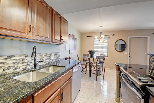 kitchen with light tile floors, a notable chandelier, hanging light fixtures, dishwasher, and sink