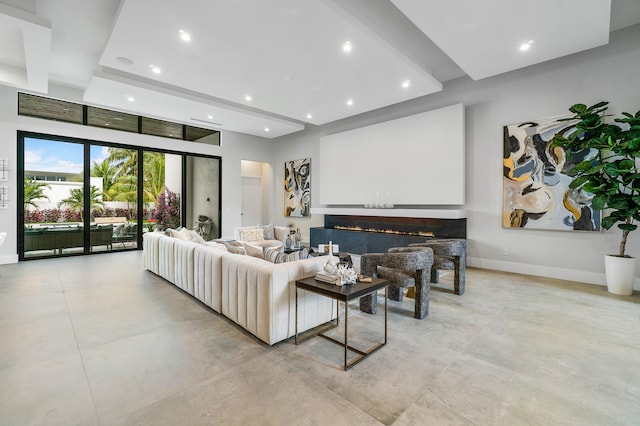 living room with beam ceiling and light tile flooring