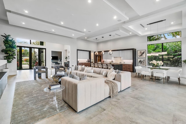 living room with french doors and a high ceiling