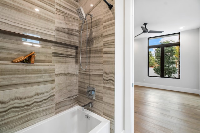 bathroom featuring tiled shower / bath combo, ceiling fan, and hardwood / wood-style floors