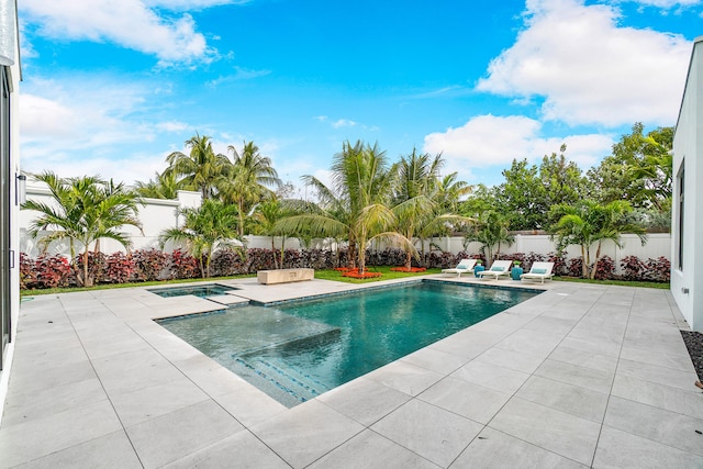 view of pool featuring a patio