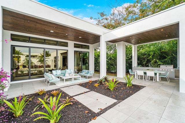 view of terrace with an outdoor hangout area and grilling area