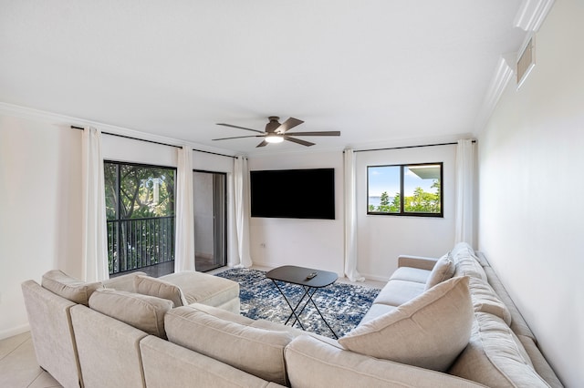 tiled living room featuring ceiling fan and ornamental molding