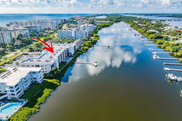 birds eye view of property featuring a water view