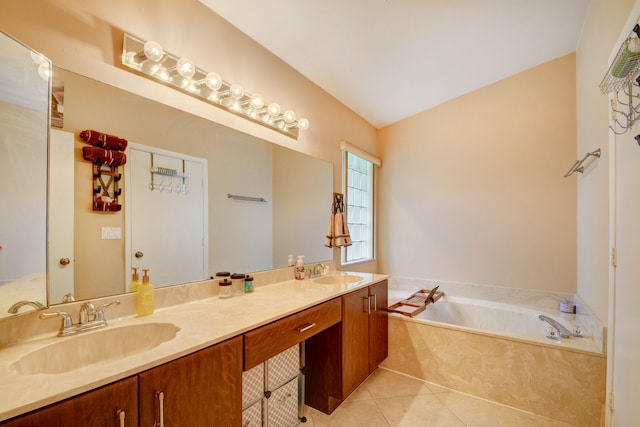 bathroom with vaulted ceiling, double sink, vanity with extensive cabinet space, tile flooring, and a tub