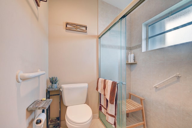 bathroom featuring walk in shower, toilet, and tile flooring