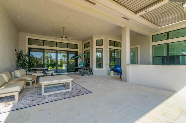 view of terrace featuring an outdoor living space and ceiling fan