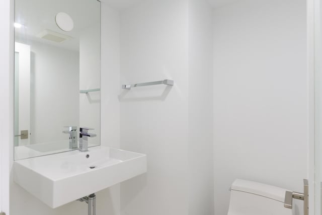 bathroom with sink and toilet