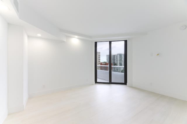 empty room featuring light hardwood / wood-style floors