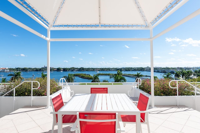 view of terrace featuring a water view