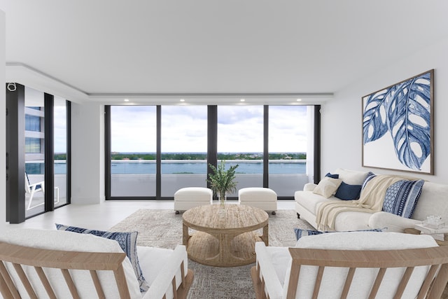 living room featuring a water view and expansive windows